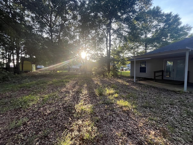8945 Bluebell St, Milton, FL 32583 - view of yard featuring french doors