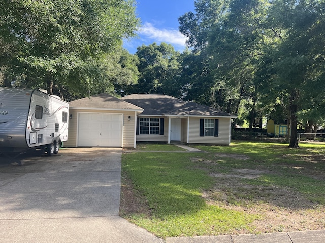 8945 Bluebell St, Milton, FL 32583 - ranch-style house featuring an attached garage, driveway, and a front lawn