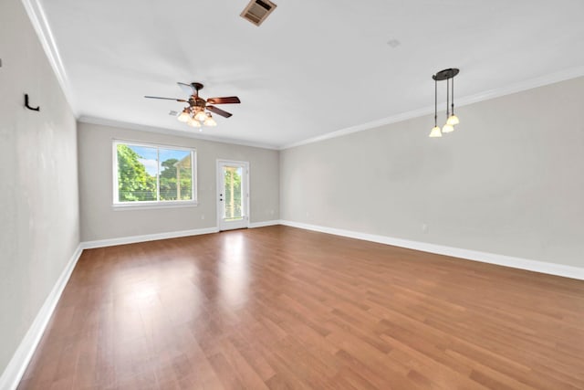526 Valparaiso Pkwy Unit B, Valparaiso, FL 32580 - unfurnished room featuring crown molding, ceiling fan, wood finished floors, and baseboards
