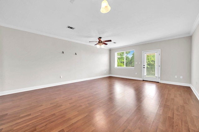 526 Valparaiso Pkwy Unit B, Valparaiso, FL 32580 - spare room featuring crown molding, wood finished floors, a ceiling fan, and baseboards