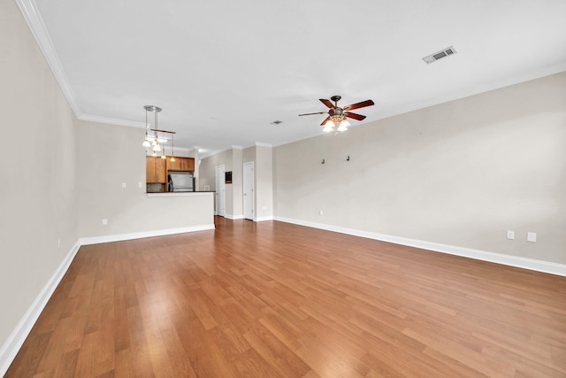 526 Valparaiso Pkwy Unit B, Valparaiso, FL 32580 - unfurnished living room featuring a ceiling fan, wood finished floors, baseboards, and ornamental molding