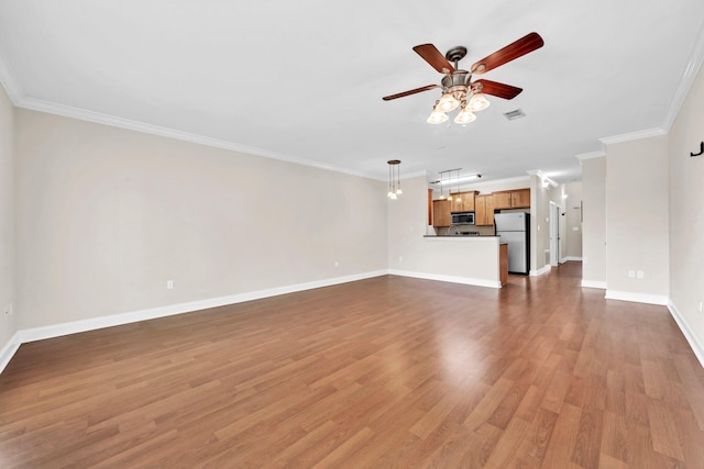 526 Valparaiso Pkwy Unit B, Valparaiso, FL 32580 - unfurnished living room with ceiling fan, crown molding, baseboards, and wood finished floors