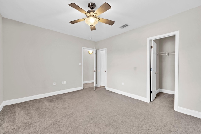 526 Valparaiso Pkwy Unit B, Valparaiso, FL 32580 - unfurnished bedroom with carpet flooring, baseboards, ceiling fan, and a walk in closet