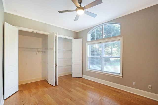 302 Sand Myrtle Trl, Destin, FL 32541 - unfurnished bedroom with light wood finished floors, ornamental molding, a closet, and ceiling fan