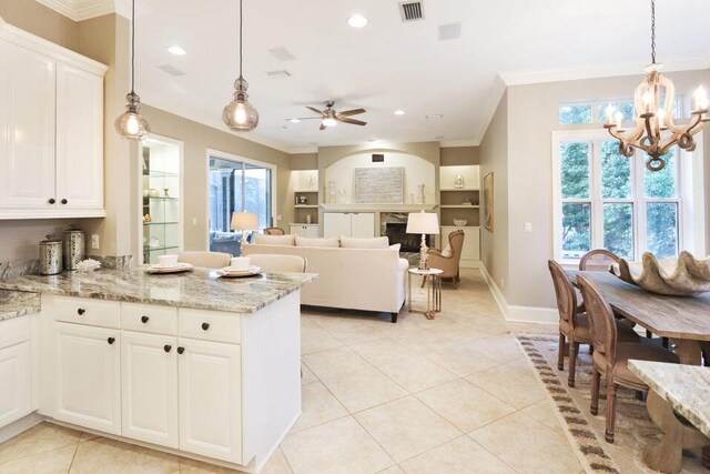 302 Sand Myrtle Trl, Destin, FL 32541 - kitchen featuring ornamental molding, a chandelier, light tile patterned floors, a peninsula, and ceiling fan