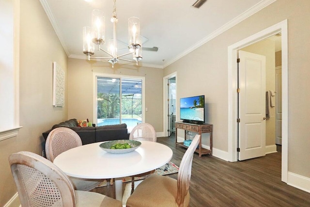 302 Sand Myrtle Trl, Destin, FL 32541 - dining room with dark wood-type flooring, a chandelier, and ornamental molding