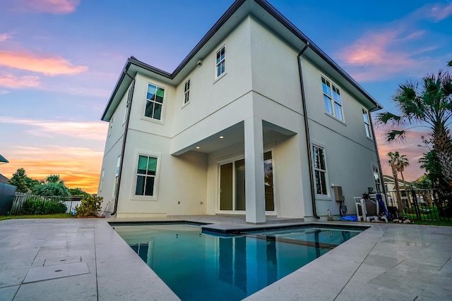 127 Avalon Blvd, Miramar Beach, FL 32550 - rear view of property with a patio and stucco siding