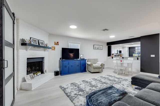 16 Court Dr, Destin, FL 32541 - living area featuring light wood-type flooring, a fireplace, and recessed lighting