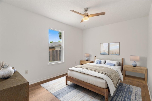 2932 Stillwell Blvd, Crestview, FL 32539 - bedroom featuring wood finished floors, baseboards, and a ceiling fan
