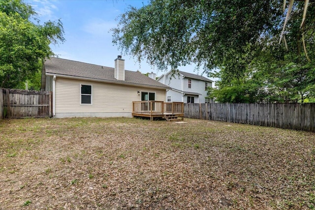 2932 Stillwell Blvd, Crestview, FL 32539 - back of house with a wooden deck and a chimney