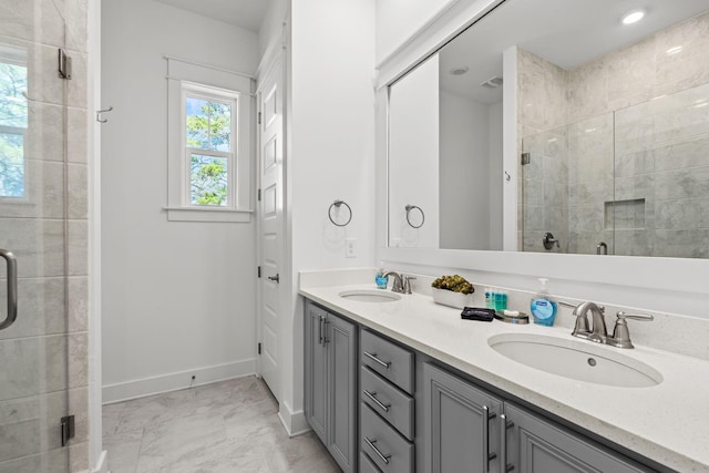 11 E Pine Lands Loop Unit A, Inlet Beach, FL 32461 - full bathroom with a stall shower, double vanity, marble look tiles, and baseboards