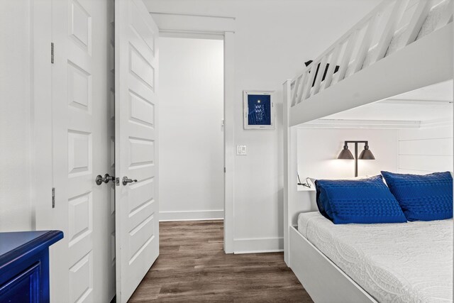 11 E Pine Lands Loop Unit A, Inlet Beach, FL 32461 - bedroom with baseboards and dark wood-style flooring