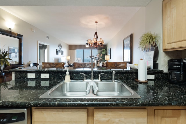 112 Seascape Dr Unit 1807, Miramar Beach, FL 32550 - kitchen featuring light brown cabinetry, a sink, open floor plan, decorative backsplash, and a chandelier