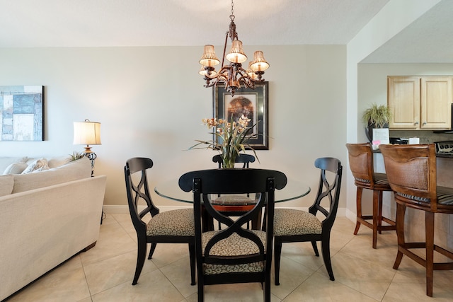 112 Seascape Dr Unit 1807, Miramar Beach, FL 32550 - dining space with a chandelier, light tile patterned flooring, and baseboards