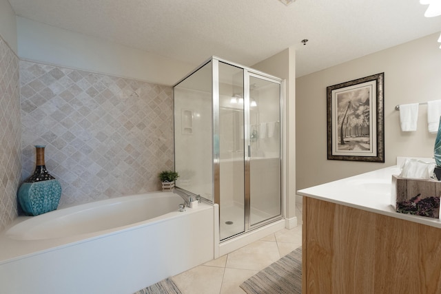 112 Seascape Dr Unit 1807, Miramar Beach, FL 32550 - bathroom featuring tile patterned floors, a shower stall, a garden tub, and vanity