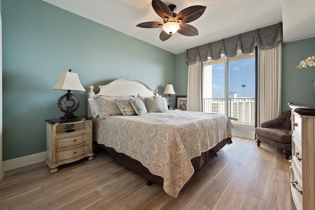 112 Seascape Dr Unit 1807, Miramar Beach, FL 32550 - bedroom featuring access to exterior, light wood-style floors, a ceiling fan, and baseboards