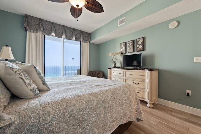 112 Seascape Dr Unit 1807, Miramar Beach, FL 32550 - bedroom featuring baseboards, wood finished floors, access to outside, and ceiling fan