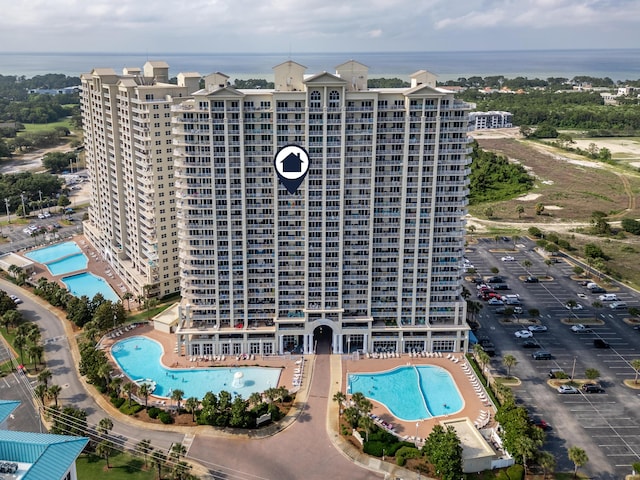 112 Seascape Dr Unit 1807, Miramar Beach, FL 32550 - drone / aerial view of a pool, a large body of water, and apartment complex