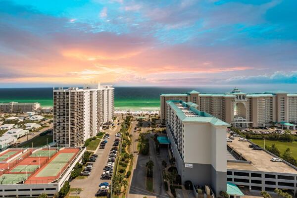 112 Seascape Dr Unit 1807, Miramar Beach, FL 32550 - aerial view at dusk of a water view and a view of city