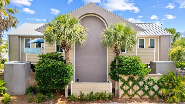 3695 Scenic Highway 98 Unit 1002, Destin, FL 32541 - view of front of property with an attached garage, a standing seam roof, and metal roof