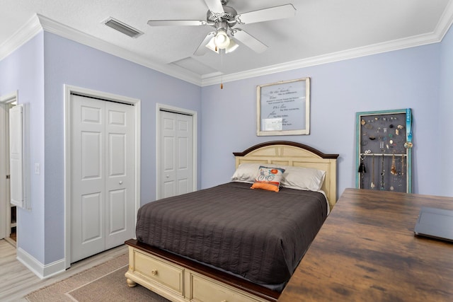 3695 Scenic Highway 98 Unit 1002, Destin, FL 32541 - bedroom with ornamental molding, two closets, light wood finished floors, ceiling fan, and baseboards