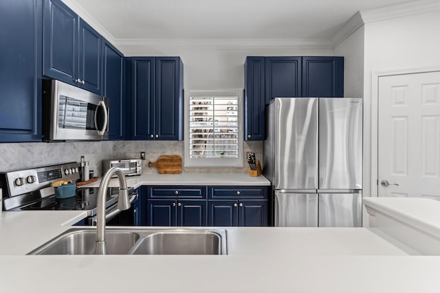 3695 Scenic Highway 98 Unit 1002, Destin, FL 32541 - kitchen featuring appliances with stainless steel finishes, blue cabinets, ornamental molding, backsplash, and light countertops