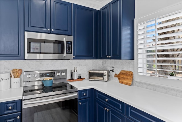 3695 Scenic Highway 98 Unit 1002, Destin, FL 32541 - kitchen with stainless steel appliances, blue cabinets, light countertops, and tasteful backsplash