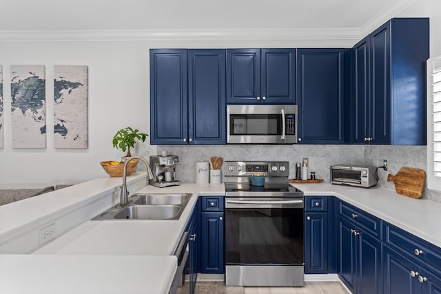 3695 Scenic Highway 98 Unit 1002, Destin, FL 32541 - kitchen featuring stainless steel appliances, a sink, blue cabinetry, ornamental molding, and light countertops