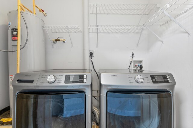 4507 Furling Ln Unit 302, Destin, FL 32541 - laundry area with washer and clothes dryer