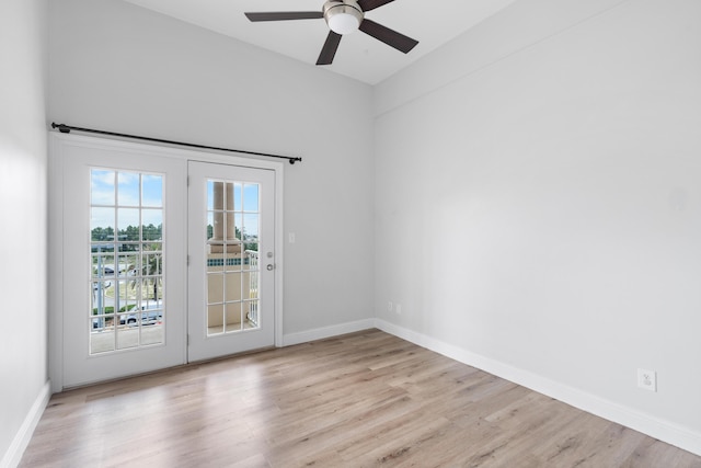4507 Furling Ln Unit 302, Destin, FL 32541 - empty room with wood finished floors, a ceiling fan, and baseboards