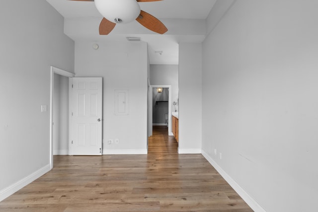4507 Furling Ln Unit 302, Destin, FL 32541 - unfurnished bedroom featuring light wood-style flooring, ensuite bathroom, baseboards, and electric panel