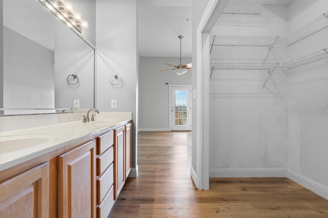 4507 Furling Ln Unit 302, Destin, FL 32541 - full bathroom featuring wood finished floors, double vanity, and ceiling fan