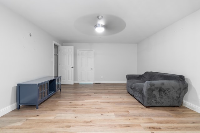 4507 Furling Ln Unit 302, Destin, FL 32541 - sitting room with ceiling fan, baseboards, and light wood-style flooring