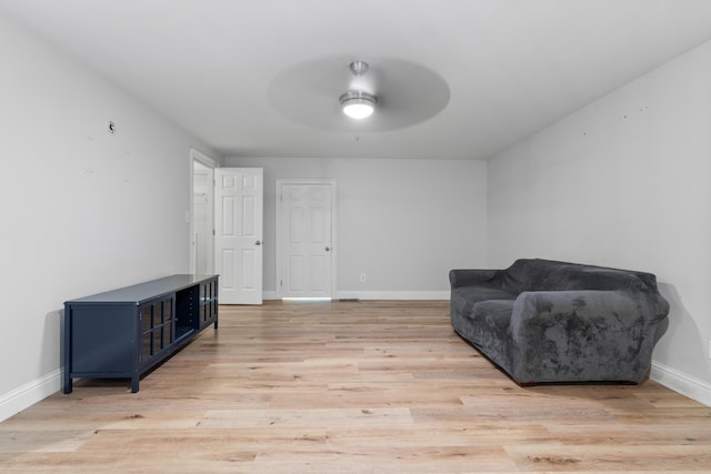 4507 Furling Ln Unit 302, Destin, FL 32541 - sitting room featuring ceiling fan, baseboards, and light wood-type flooring
