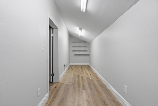 4507 Furling Ln Unit 302, Destin, FL 32541 - hall featuring vaulted ceiling, light wood-type flooring, and baseboards