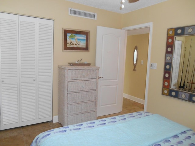 3857 Indian Trl Unit 203, Destin, FL 32541 - bedroom featuring tile patterned floors, a closet, and baseboards