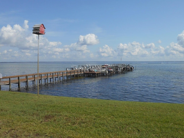 3857 Indian Trl Unit 203, Destin, FL 32541 - dock area featuring a water view and a yard