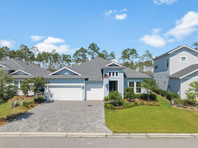 282 W Lafayette Rd, Inlet Beach, FL 32461 - view of front of home featuring a garage, decorative driveway, a front lawn, and roof with shingles