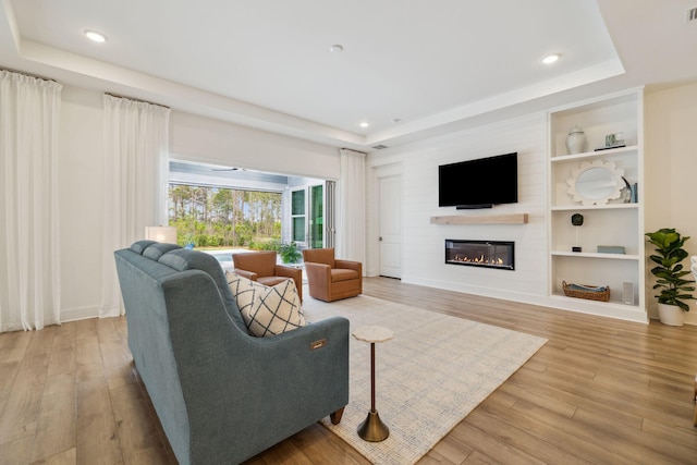 282 W Lafayette Rd, Inlet Beach, FL 32461 - living area featuring a tray ceiling, a fireplace, light wood finished floors, and recessed lighting