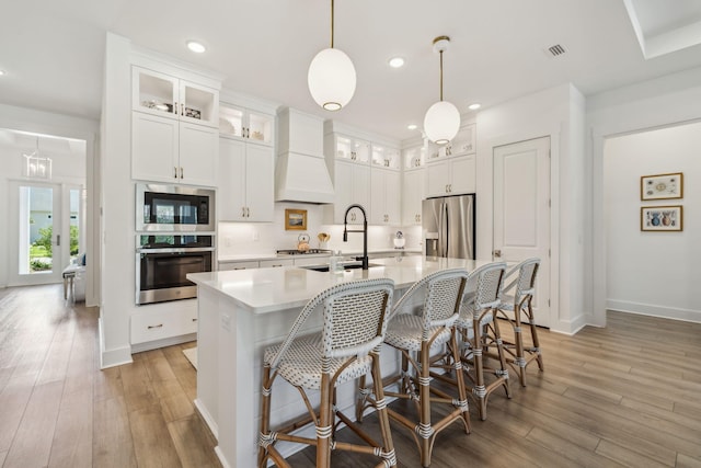282 W Lafayette Rd, Inlet Beach, FL 32461 - kitchen with stainless steel appliances, light wood-type flooring, light countertops, white cabinets, and recessed lighting