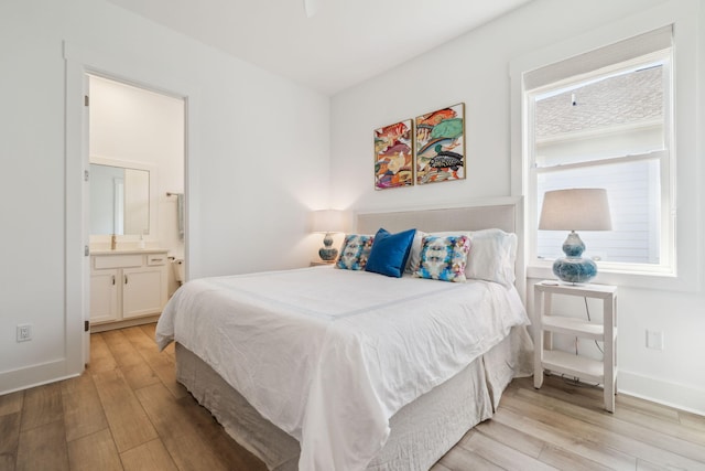 282 W Lafayette Rd, Inlet Beach, FL 32461 - bedroom featuring light wood-style flooring and connected bathroom