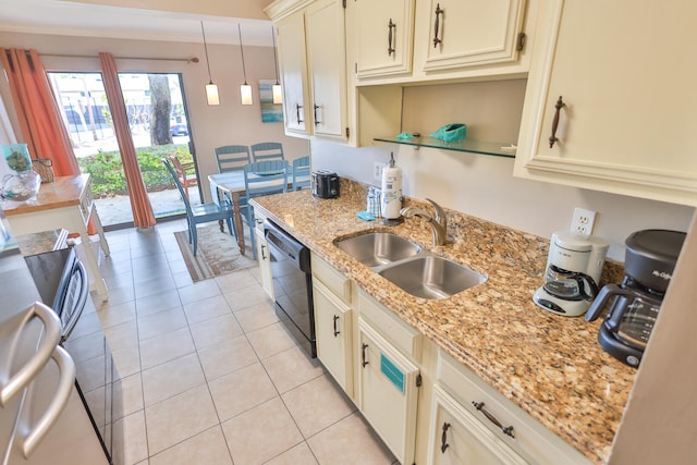 196 N Driftwood Bay Unit 38A, Miramar Beach, FL 32550 - kitchen featuring black dishwasher, a sink, cream cabinetry, light tile patterned flooring, and hanging light fixtures
