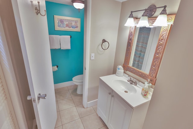 196 N Driftwood Bay Unit 38A, Miramar Beach, FL 32550 - bathroom featuring toilet, vanity, tile patterned floors, and baseboards