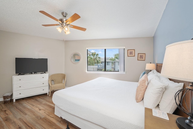 285 Payne St Unit 23B, Miramar Beach, FL 32550 - bedroom with wood finished floors, ceiling fan, and a textured ceiling