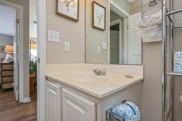285 Payne St Unit 23B, Miramar Beach, FL 32550 - bathroom with wood finished floors and vanity