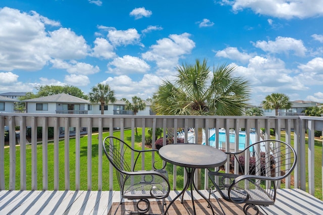 285 Payne St Unit 23B, Miramar Beach, FL 32550 - wooden terrace with a yard, a community pool, and a residential view