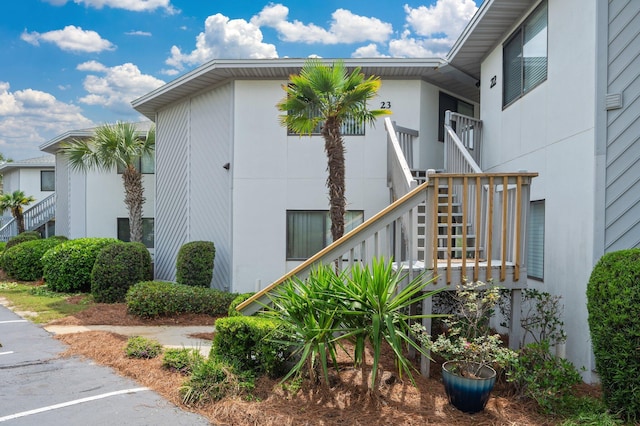 285 Payne St Unit 23B, Miramar Beach, FL 32550 - view of property exterior featuring stairs and stucco siding