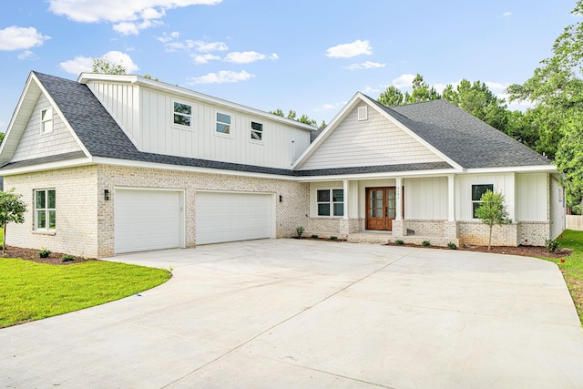 3101 Pga Blvd, Navarre, FL 32566 - modern farmhouse with french doors, board and batten siding, brick siding, and concrete driveway