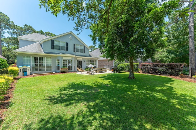 4467 Turnberry Pl, Niceville, FL 32578 - rear view of property with a shingled roof and a patio