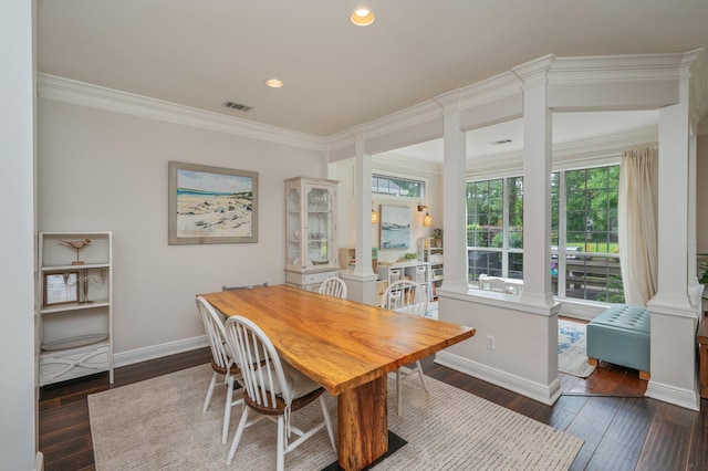 4467 Turnberry Pl, Niceville, FL 32578 - dining space featuring hardwood / wood-style floors, crown molding, baseboards, recessed lighting, and decorative columns
